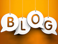 The word Blog hanging by strings on orange background