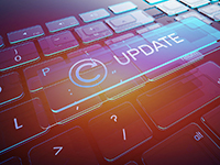 Closeup of keyboard with word update on the space key